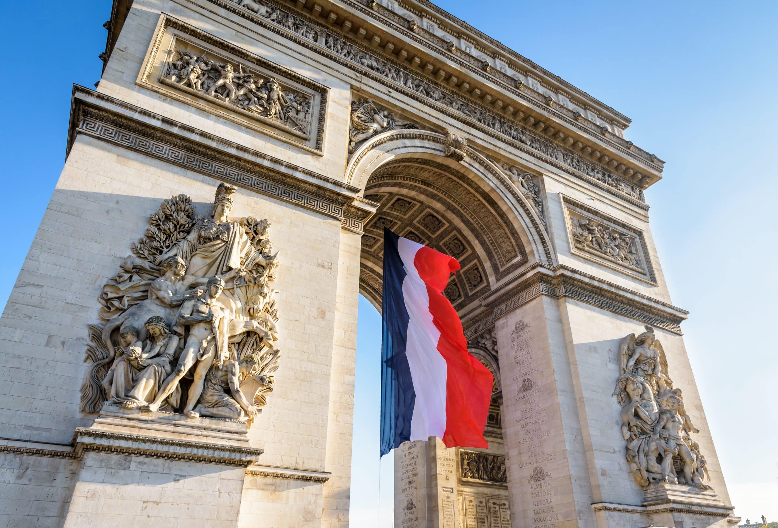 The French flag in de Arc de Triomphe in Paris